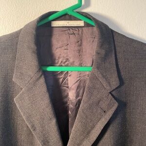 Gray Sport Coat with Notched Lapels and double vents.